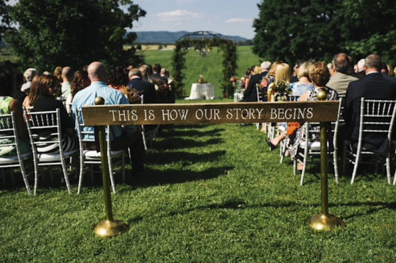 signage at aisle of wedding ceremony, photo by The Oberports