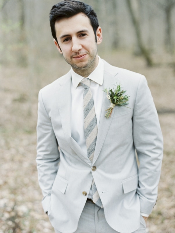 groom in grey suit with striped grey tie, photo by Erich McVey Photography