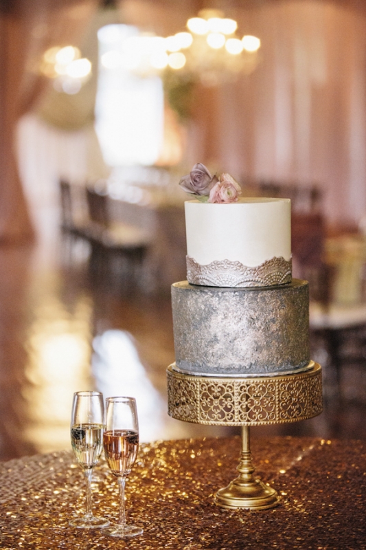 white tiered cake with silver lace overlay on gold filigree cake stand, photo by Vue Photography