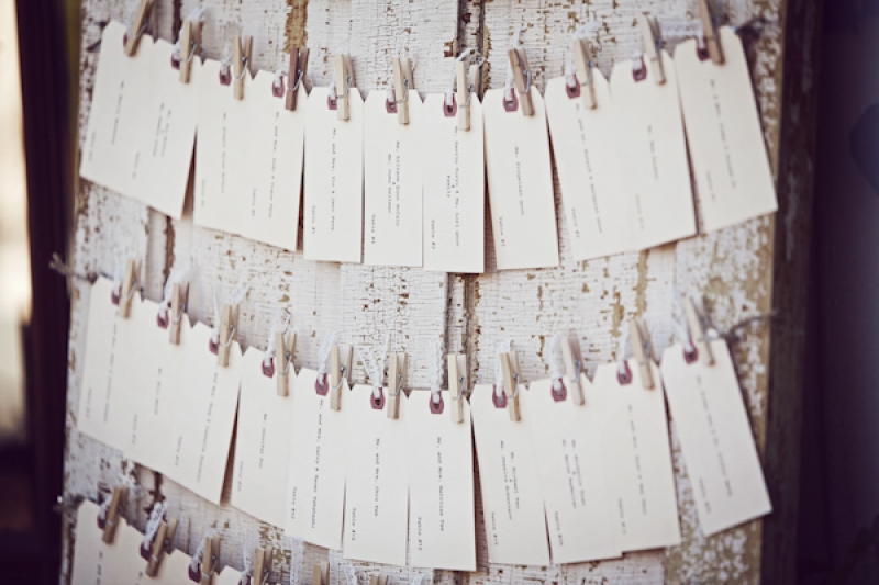 rustic white and brown escort cards on clothesline, photo by Duke Photography