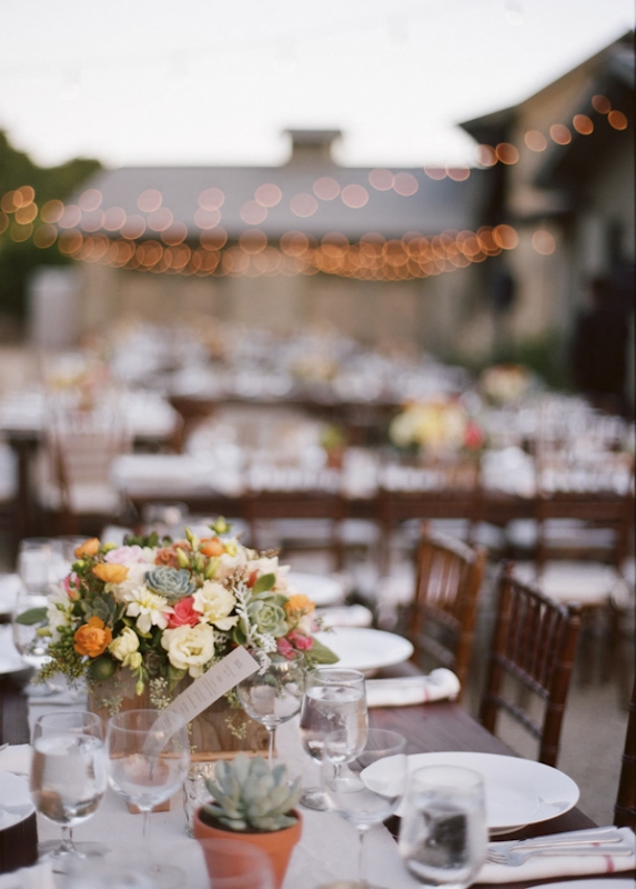 outdoor seating, with succulent floral arrangements, photo by Raya Carlisle Photography