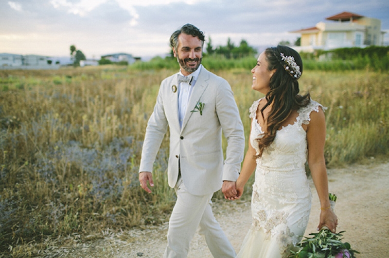 happy bride and groom in Greek destination wedding, photo by Adam Alex