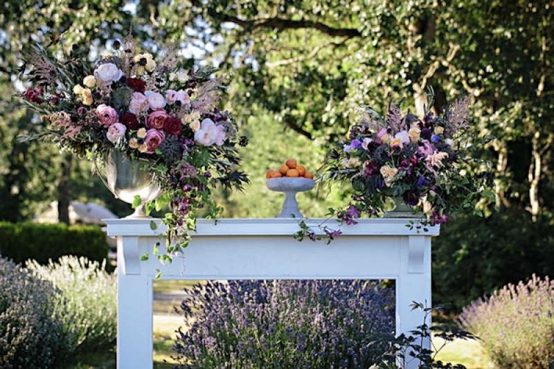 floral centerpieces in shades of purple and lavender, photo by Jennifer Ballard Photography