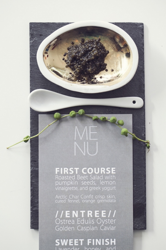 modern gray menu on slate board with caviar, photo by Studio Uma