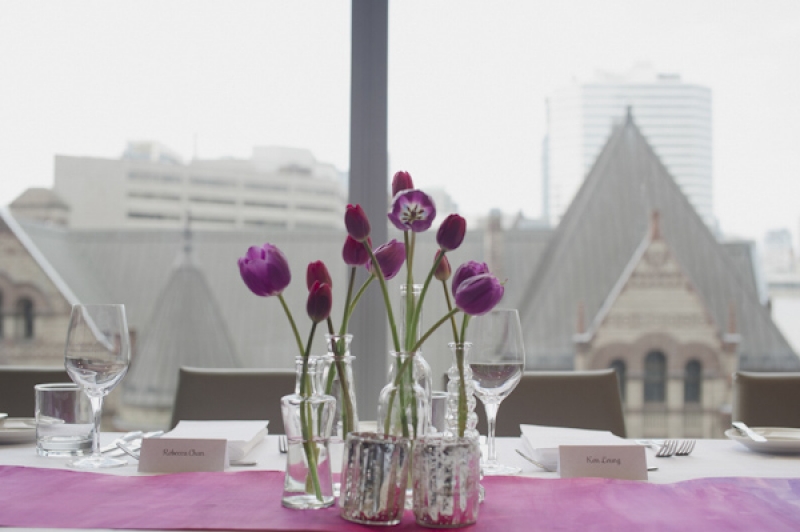 purple tulips in glass vases, photo by Aron Goss Photography