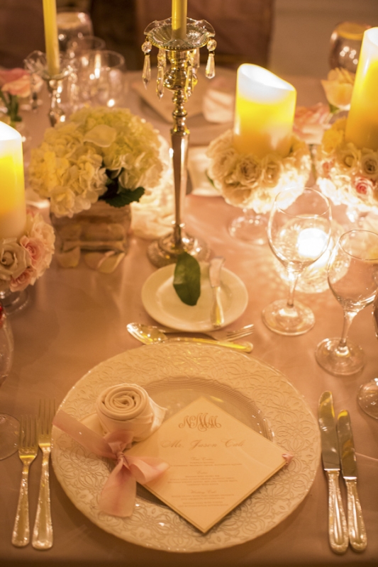pink and white place setting and table top with silver candlesticks, photo by Ira Lippke Studios