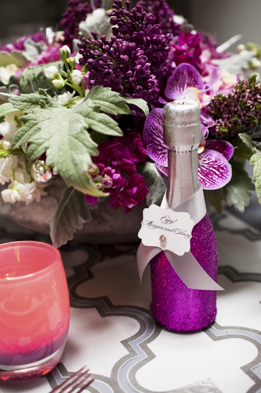 sparkly purple champagne wedding favor with purple floral arrangement, photo by Nikki Closser