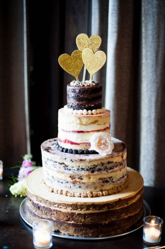 Momofoku layered wedding cake with gold heart cake toppers