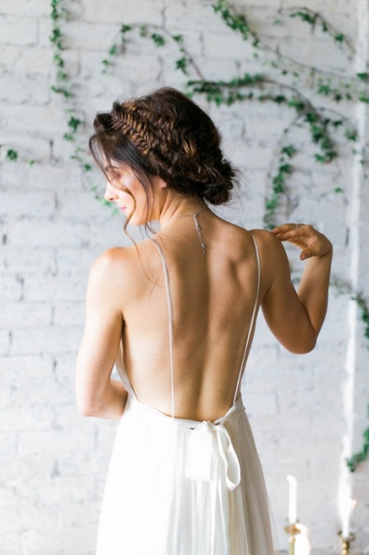 boho bridal fishtail braid, low-back spaghetti strap gown by Cleo & Clementine