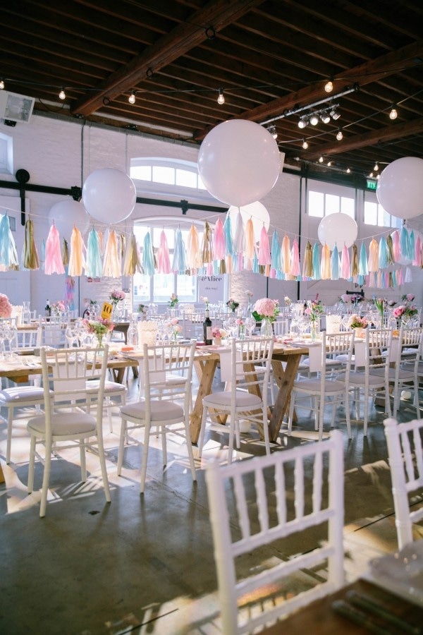 Colorful Industrial Wedding Venue with Tassels and Balloons