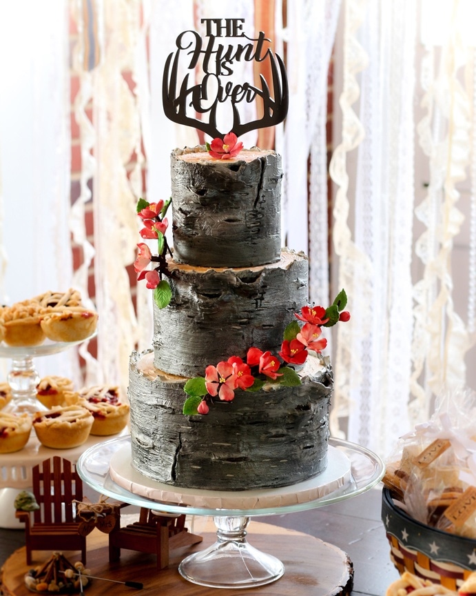 All American Bark-Inspired Wedding Cake with Antler Cake Topper and Sugar Cherry Blossoms