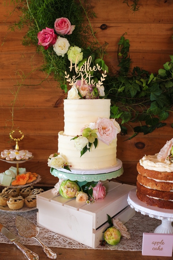 Elegant Garden-Inspired Dessert Display with Pale Pink and Greenery Color Palette