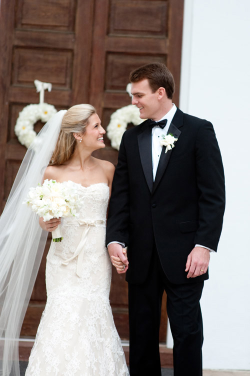 Romantic portrait of bride and groom at southern garden wedding in Charleston, South Carolina, photography by Leigh Webber