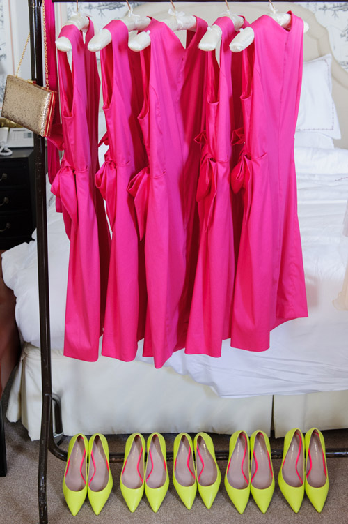 hot pink and neon yellow bridesmaids' dresses and shoes, photo by Jeremy Enness | via junebugweddings.com