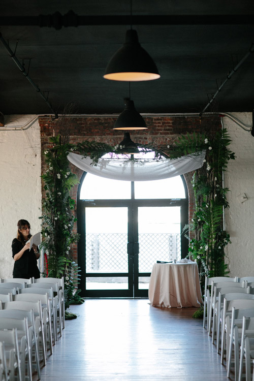 industrial wedding at The Liberty Warehouse, Brooklyn, NY with woodland decor - Elizabeth Duncan Events and Gulnara Studios | via junebugweddings.com