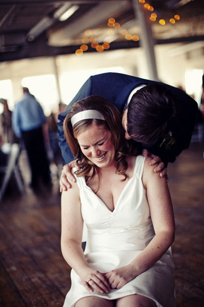 Laughing bride and groom wedding reception image by Sean Flanigan Photography