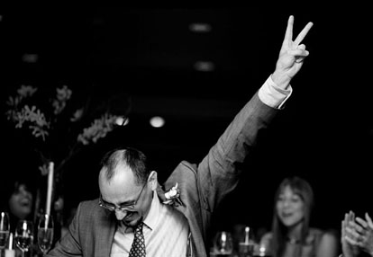 Wedding reception toast celebration image by Yours by John Photography