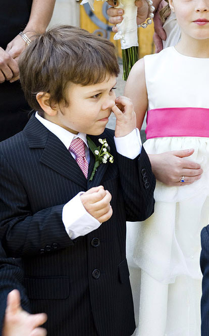 Mischievous little ring bearer at a wedding, image by Laurel McConnell Photography