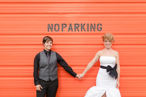 colorful orange, green, black and white same-sex wedding at the Russell Industrial Center in Detroit, Michigan, photos by Alli McWhinney