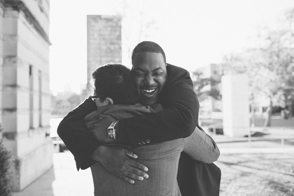 happy wedding photo of people hugging by Ely Brothers | via junebugweddings.com