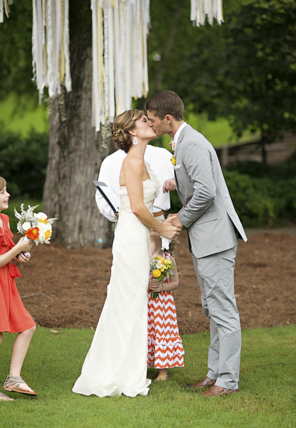 bright yellow and orange summer wedding in Atlanta, photo by Paperlily Photography | via junebugweddings.com