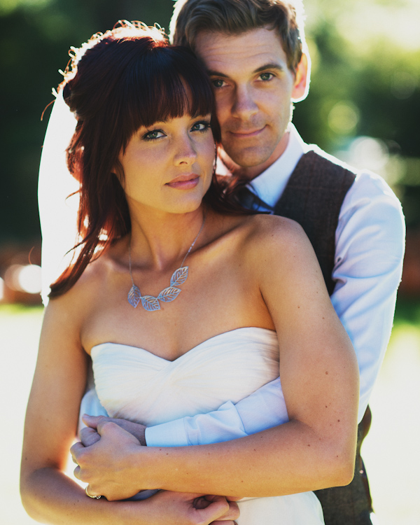 bride and groom portrait, photo by Erik Clausen| via junebugweddings.com