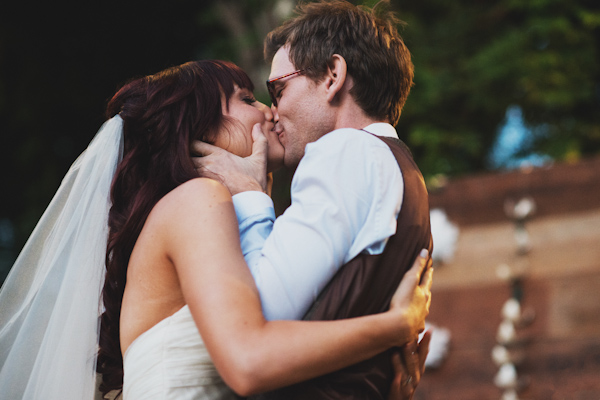 garden wedding first kiss, photo by Erik Clausen | via junebugweddings.com