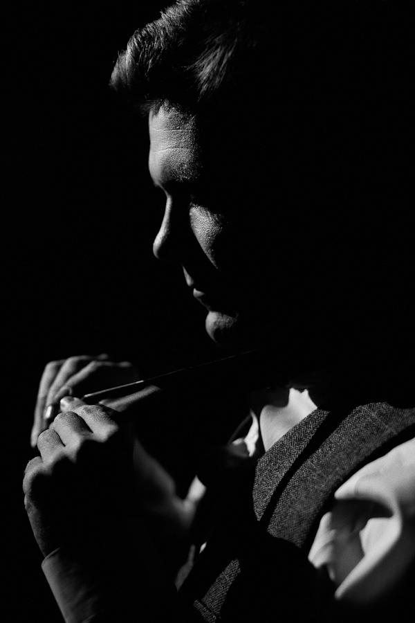 groom getting ready, photo by Erik Clausen | via junebugweddings.com