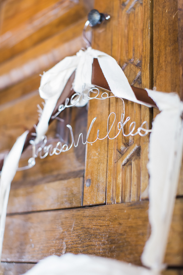 personalized wedding dress hanger, photo by Rachel Solomon | via junebugweddings.com