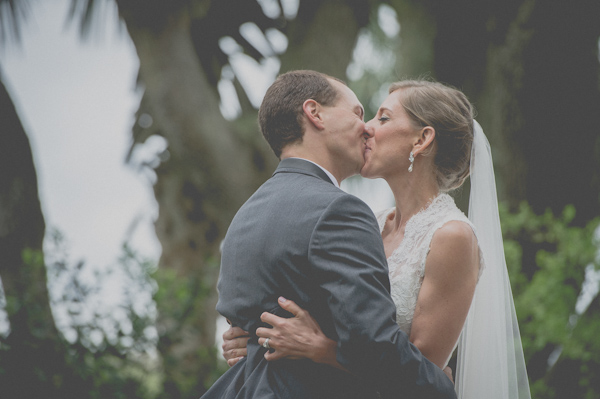 first kiss, photo by Still55 Photography | via junebugweddings.com