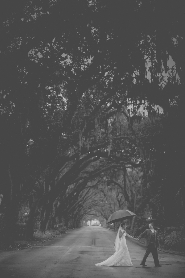 wedding portrait in the rain, photo by Still55 Photography | via junebugweddings.com