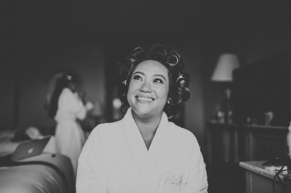 bride getting ready with hair curlers