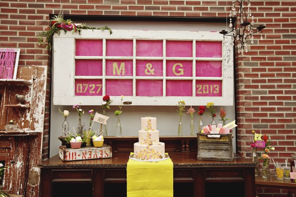 pink and yellow wedding dessert table