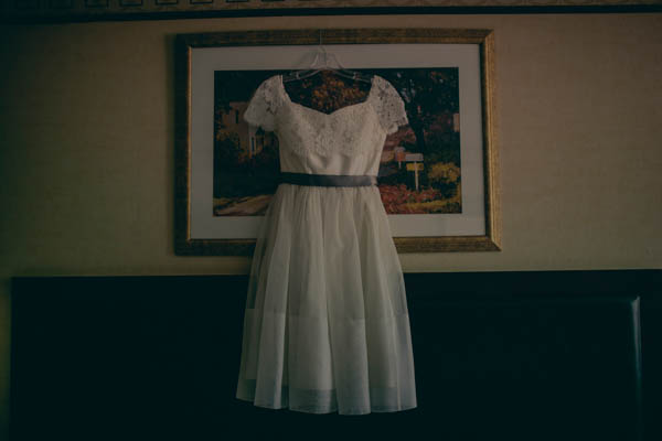 elegant lace tea-length wedding dress by Elizabeth Dye, photo by Storytellers & Co. | via junebugweddings.com