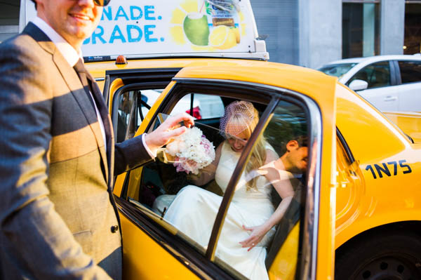 New York bride getting into a taxi