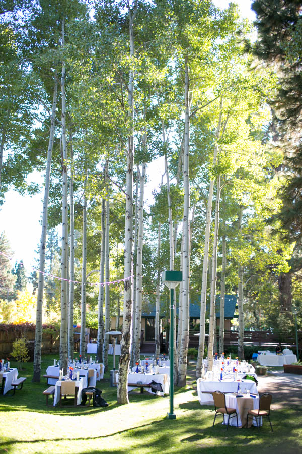 outdoor Lake Tahoe wedding reception decor, photo by Bogdan Condor | via junebugweddings.com