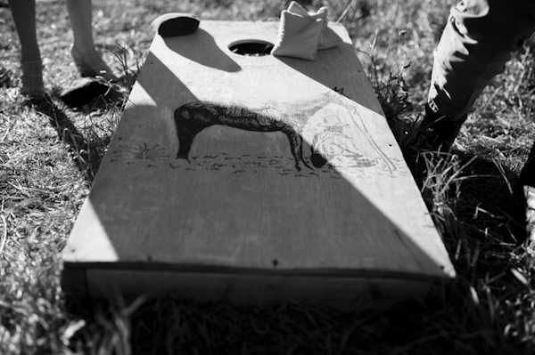 wedding cornhole game, photo by Chowen Photography | via junebugweddings.com