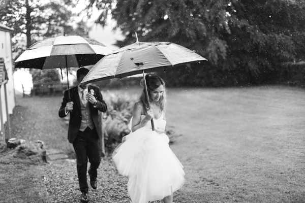 wedding portrait in the rain, photo by Sansom Photography | via junebugweddings.com