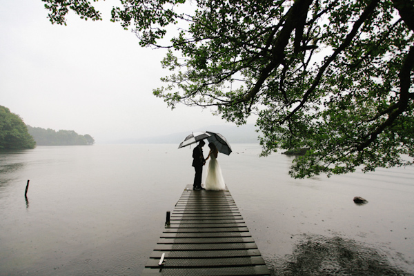 wedding portrait in the rain, photo by Sansom Photography | via junebugweddings.com