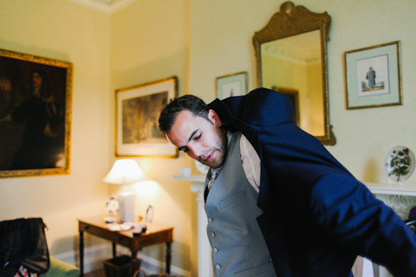 groom getting ready, photo by Sansom Photography | via junebugweddings.com