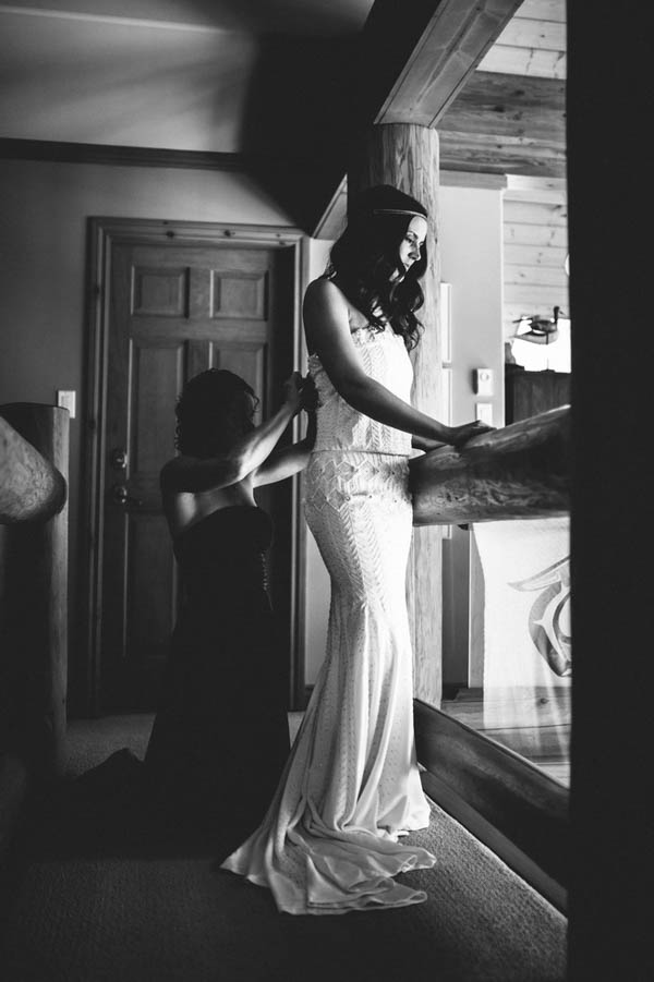 elegant bride getting dressed portrait