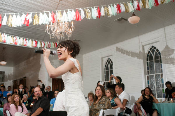wedding reception fun, bride singing