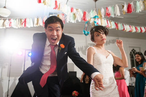funny bride and groom dance party shot