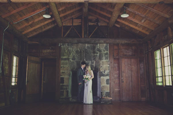 romantic couple's portrait in a cabin with fireplace
