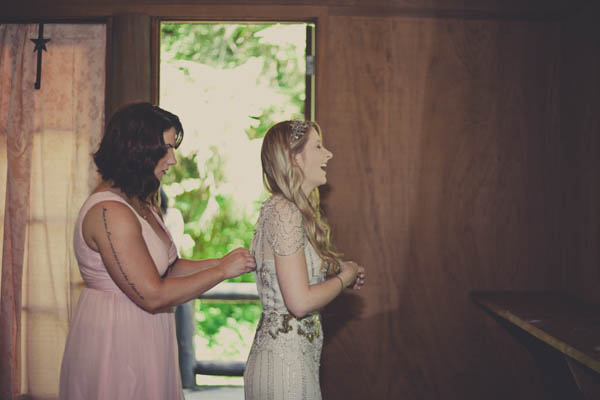 bride getting in her wedding dress portrait