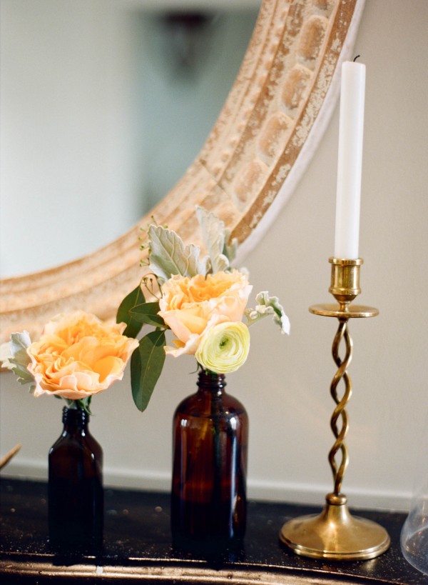 gold candlestick and bottle vases