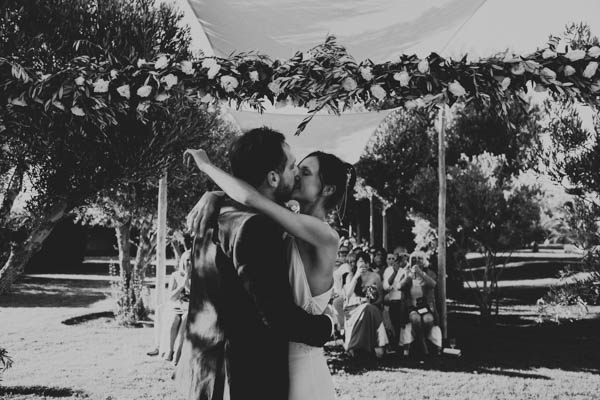 romantic destination wedding ceremony kiss