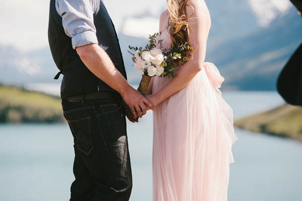 holding hands during the ceremony