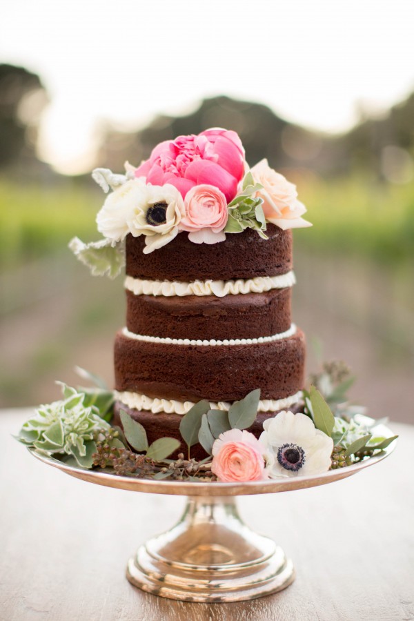 adorable chocolate naked cake topped with flowers