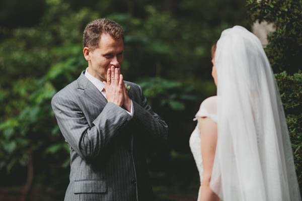 sweet groom during first look